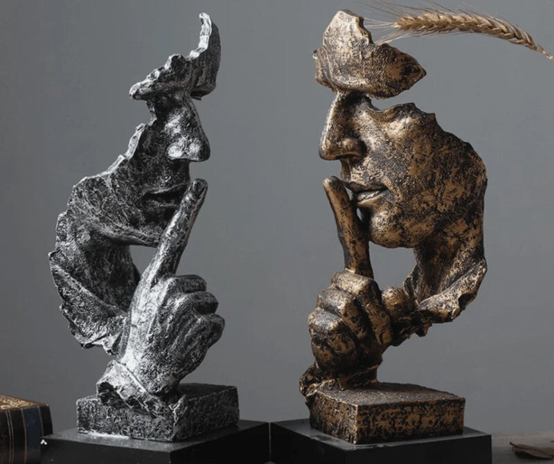 Escultura "O silêncio vale ouro"